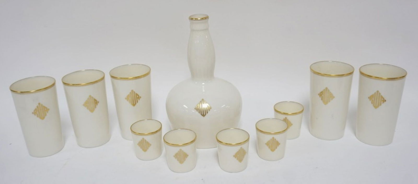 LENOX GREEN MARK DECANTOR W/5 GLASSES & 5 TUMBLERS: LENOX GREEN MARK DECANTOR W/5 SHOT GLASSES & 5 TUMBLERS, ALL MONGRAMMED W/GILT ACCENTS, DECANTOR APPRAOXIMATELY 9 IN HIGH