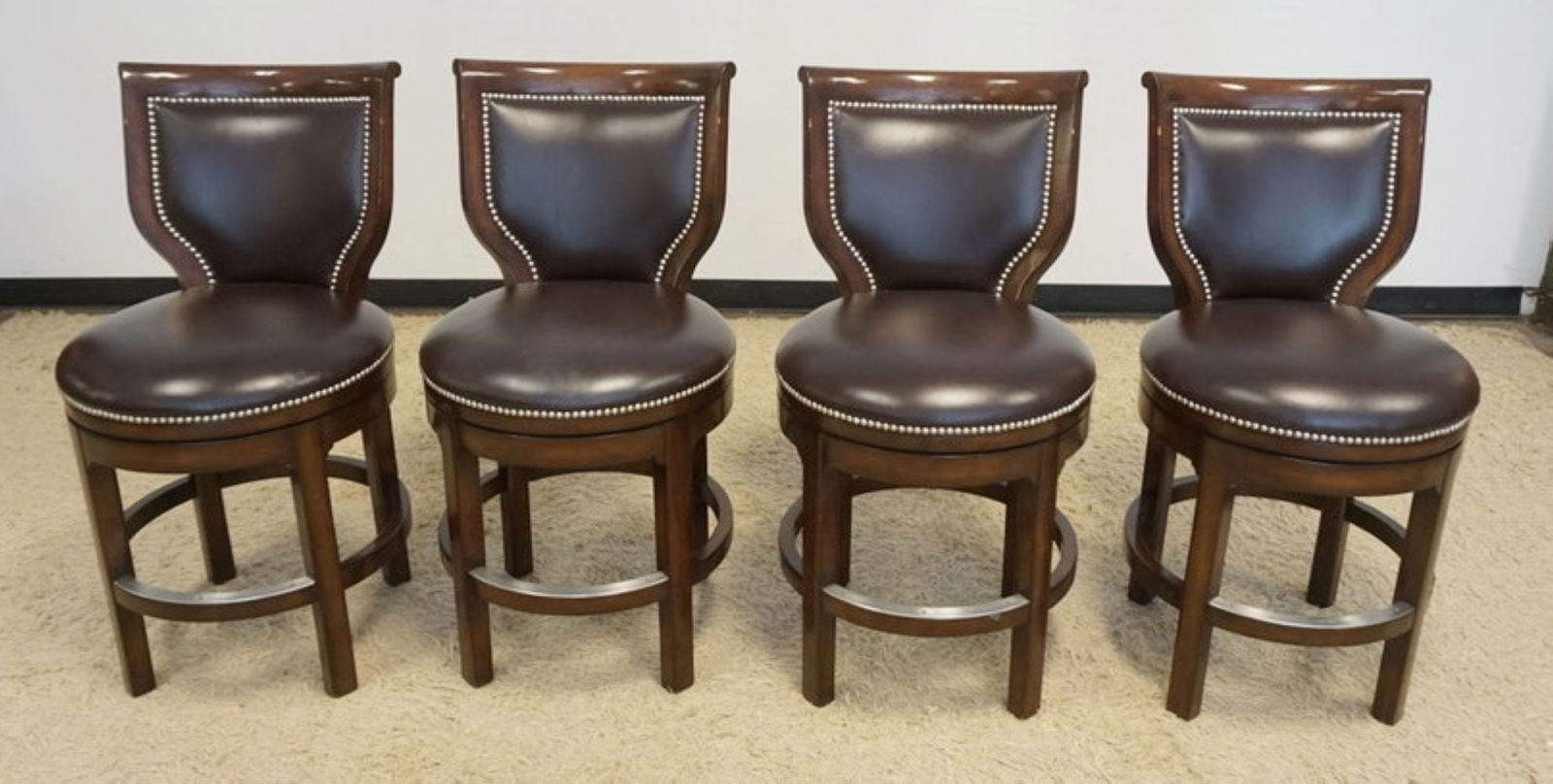 WOODBRIDGE FURNITURE BAR STOOLS: WOOD BRIDGE FURNITURE SWIVEL BAR STOOLS WITH METAL TACK ACCENTS, SEAT HEIGHT APPROXIMATELY 25 IN H, OVERALL HEIGHT 39 IN H