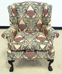UPHOLSTERED BALL & CLW FOOT WING CHAIR