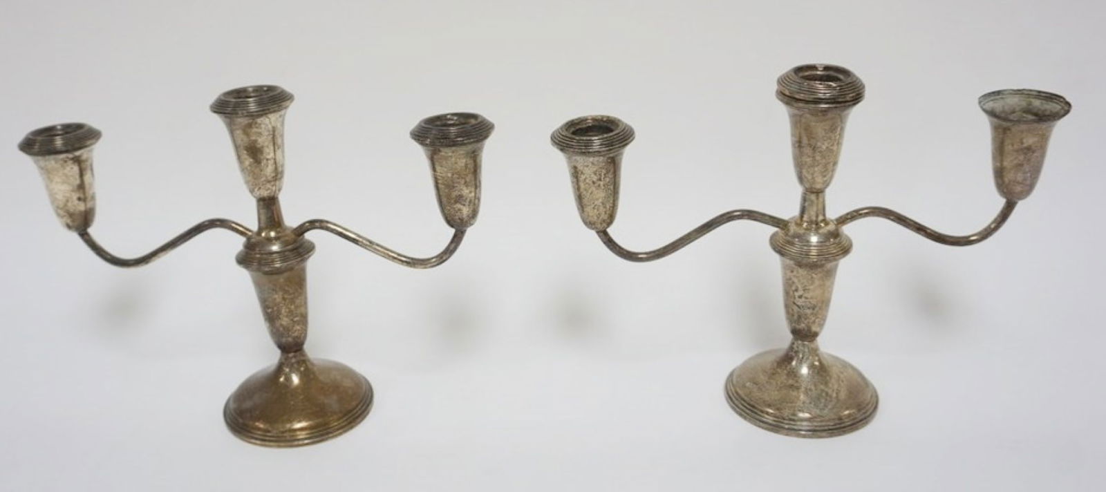 STERLING SILVER WEIGHTED CANDLEABRA: EMPIRE STERLING SILVER WEIGHTED CANDLEABRA, EACH APPROXIMATELY 10 1/2 IN X 8 IN H, 1 MISSING CANDLE INSERT