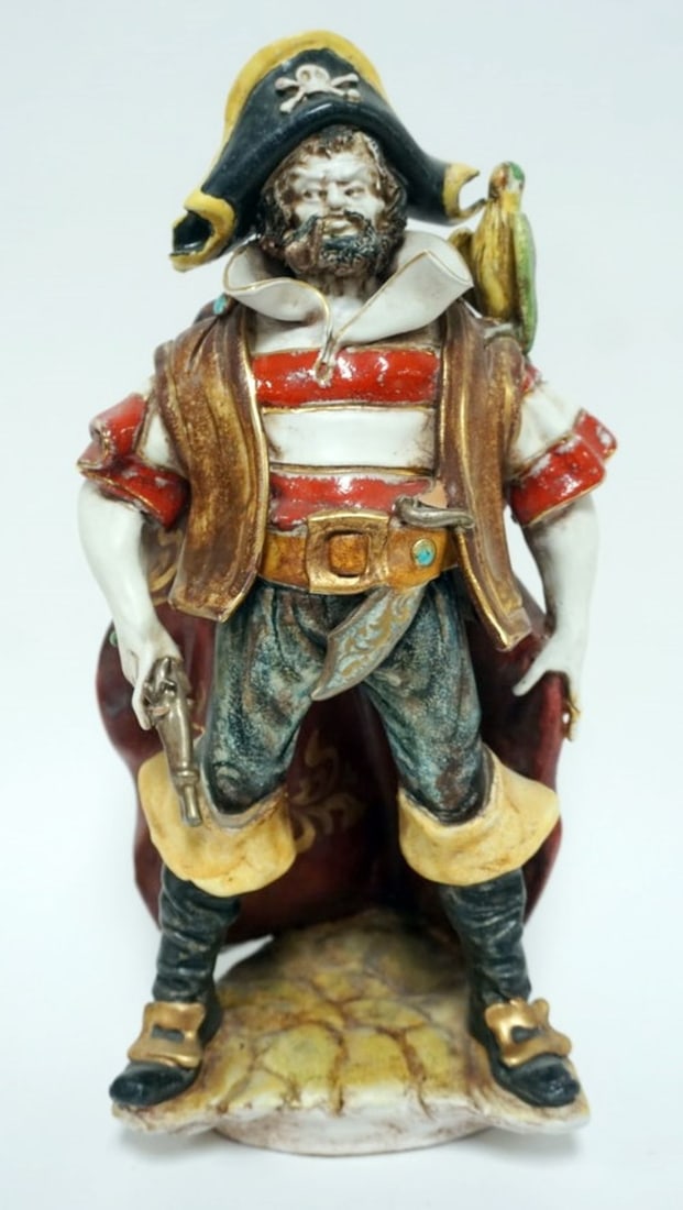 ITALIAN TERRACOTTA PIRATE FIGURE: ITALIAN TERRACOTTA FIGURE OF A PIRATE STANDING WITH GUN IN HAND AND PARROT ON SHOULDER, APPROXIMATELY 15 IN H