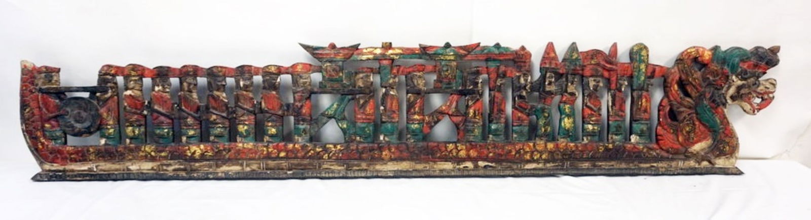 CARVED WOOD ASIAN PANEL: LONG CARVED WOOD ASIAN PANEL DEPICTING MEN IN SHIP, APPROXIMATELY 77 IN X 13 IN H