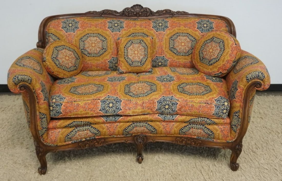 WALNUT CARVED UPHOLSTERED LOVE SEAT: WALNUT CARVED UPHOLSTERED LOVE SEAT, APPROXIMATELY 60 IN X 32 IN X 37 IN H
