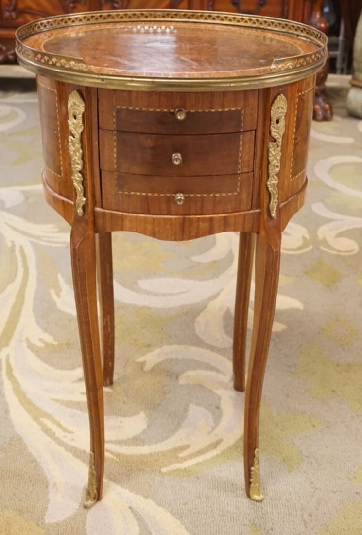 OVAL STAND WITH BRONZE GALLERY TOP: SMALL OVAL 3 DRAWER STAND WITH BRONZE GALLERY TOP AND APPLIED MOUNTS, APPROXIMATELY 16 IN X 13 IN X 29 IN H