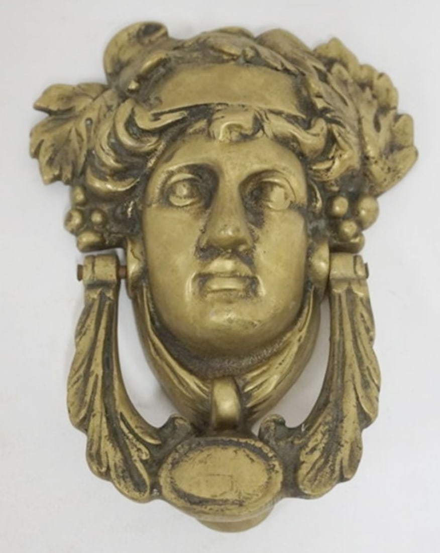BRASS CAST DOOR KNOCKER: NEOCLASSICAL IMAGE ON BRASS CAST DOOR KNOCKER, APPROXIMATELY 7 IN X 6 IN