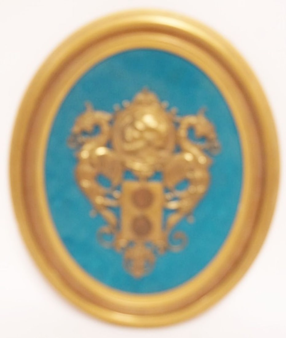 FRAMED CAST METAL IMAGE: FRAMED CAST METAL IMAGE OF MANS PROFILE FLANKED BY 2 DRAGONS W/2 BRITISH COINS BELOW, APPROXIMATELY 14 IN X 17 IN OVERALL