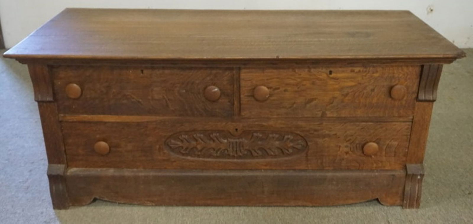 OAK LOW CHEST WITH CARVED FRONT (1 of 3)