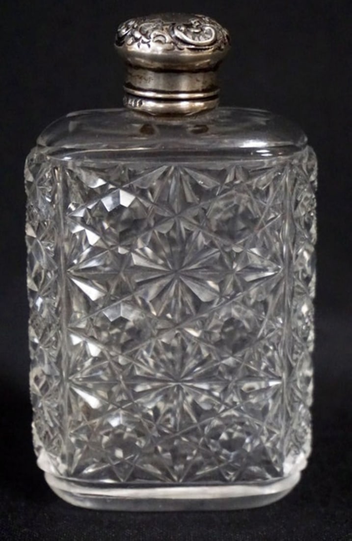 CUT GLASS FLASK STERLING LID: CUT GLASS FLASK WITH REPOUSSE STERLING LID, APPROXIMATELY 4 IN H