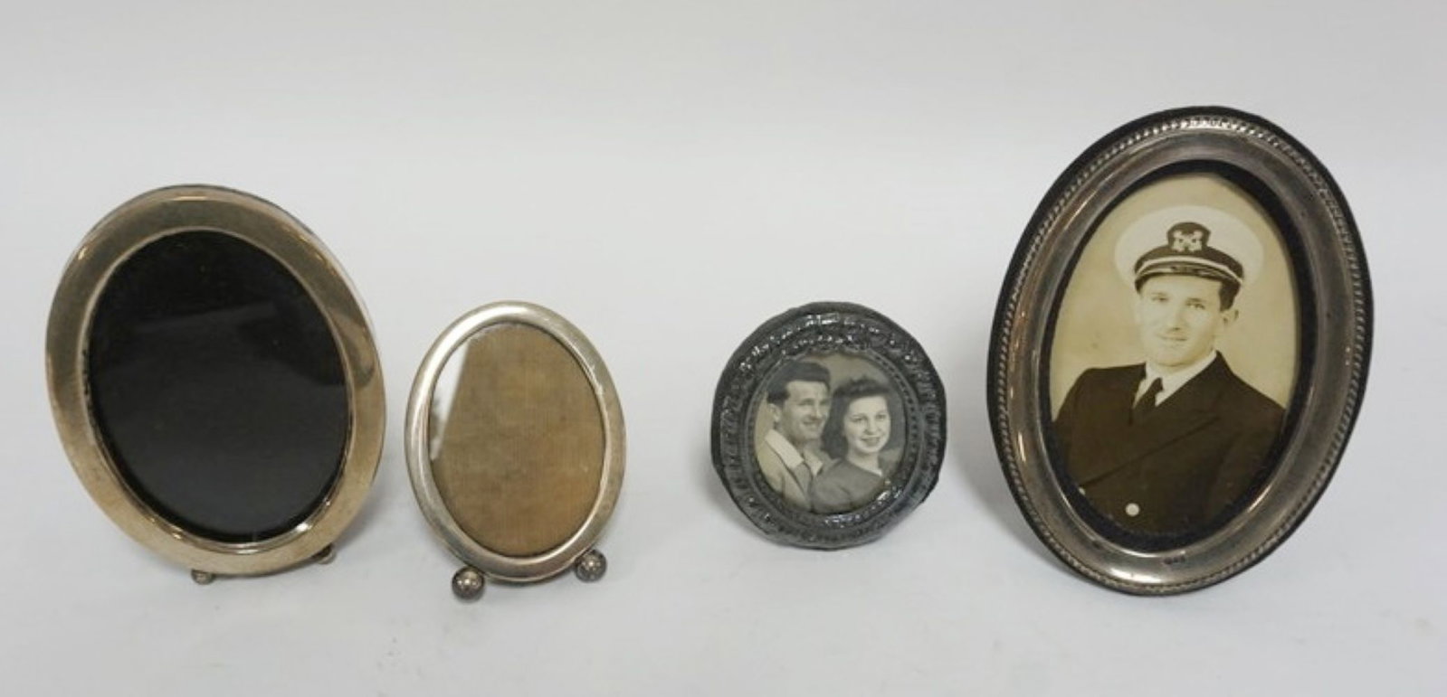 SILVER AND STERLING SILVER FRAMES: GROUP OF 4 SILVER AND STERLING SILVER FRAMES, LARGEST APPROXIMATELY 6 IN X 4 IN