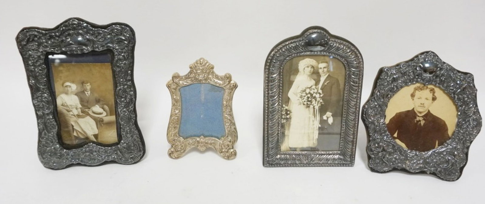 SILVER & STERLING FACED FRAMES: GROUP OF 4 SILVER AND STERLING FACED FRAMES, 1 MARKED POOLE, LARGEST APPROXIMATELY 9 IN X 6 IN