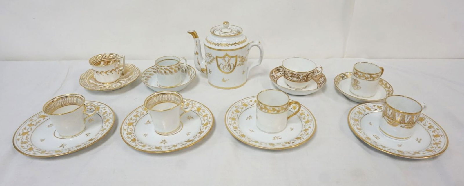 GROUP OF ASSORTED ANTIQUE FRENCH PORCELAIN: GROUP OF ASSORTED ANTIQUE FRENCH PORCELAIN GILT DECORATED CUPS & SAUCERS, TEAPOT, LARGEST PIECE APPROXIMATELY 7 IN
