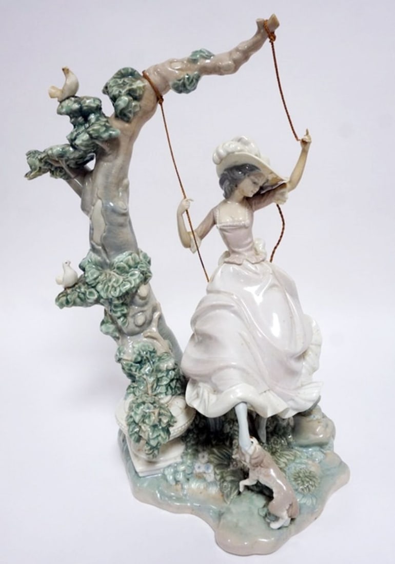 LLADRO PORCELAIN FIGURE: LLADRO PORCELAIN FIGURE *VICTORIAN GIRL ON SWING* ROPE SEPARATED ON RIGHT SIDE, APPROXIMATELY 17 IN HIGH