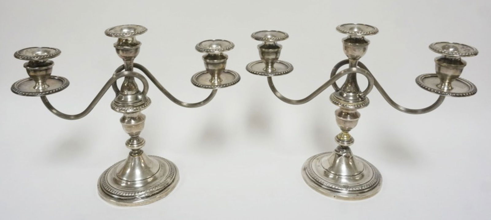 STERLING SILVER CANDELABRAS: PAIR OF STERLING SILVER WEIGHTED CANDELABRA, EACH APPROXIMATELY 10 IN H