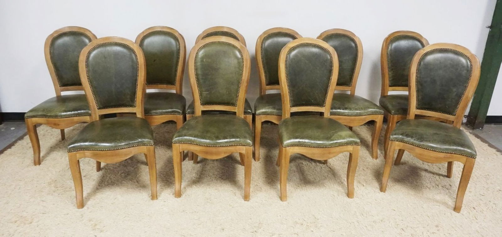 OAK SIDE CHAIRS: SET OF 10 OAK SIDE CHAIRS WITH GREEN LEATHER SEATS AND BACKS WITH BRASS TACK ACCENTS, EACH APPROXIMATELY 21 IN X 20 IN X 41 IN H