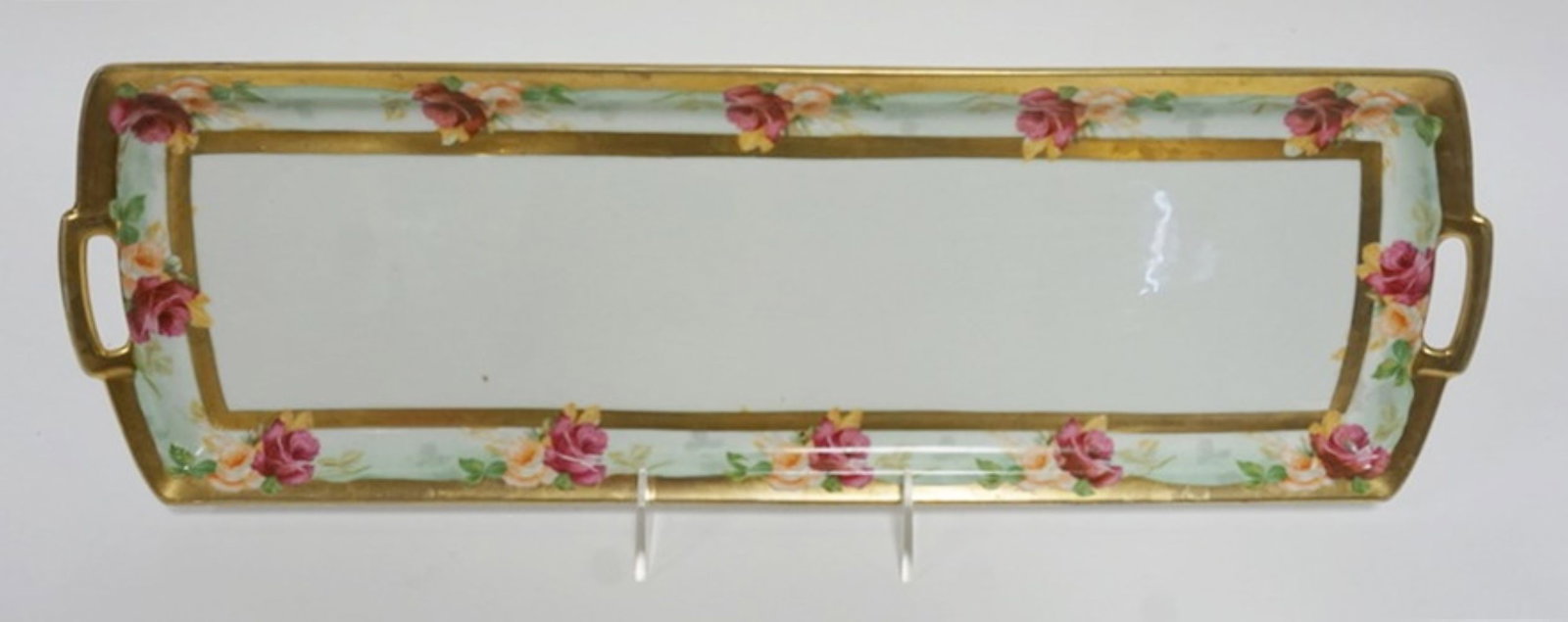 HAND PAINTED AUSTRIAN TRAY: HAND PAINTED AUSTRAIN DOUBLE HANDLE TRAY WITH IMAGES OF ROSES ON BORDER, APPROXIMATELY 19 IN X 6 1/2 IN