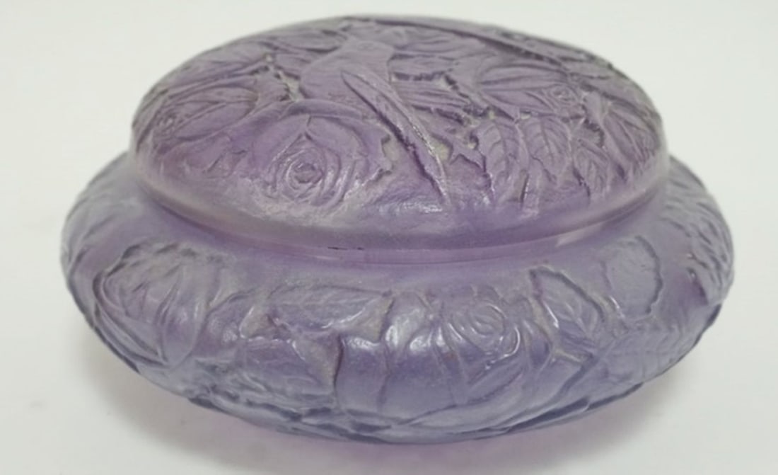 CONSOLIDATED GLASS DRESSER BOX: CONSOLIDATED GLASS EMBOSSED AMETHYST COLORED COVERED DRESSER BOX, WITH IMAGES OF BIRDS AND FLOWERS, APPROXIMATELY 7 IN X 4 IN H