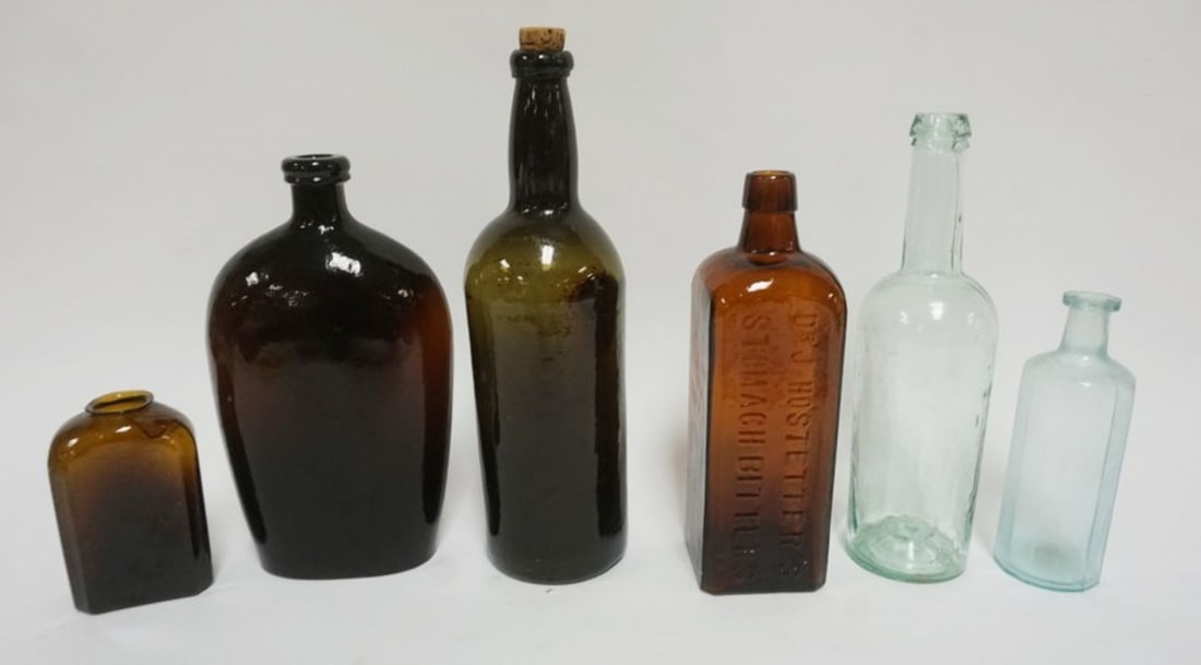 ANTIQUE BOTTLES: GROUP OF ANTIQUE BOTTLES INCLUDING DR. HOSTETTER'S STOMACH BITTERS, LARGEST APPROXIMATELY 12 IN H