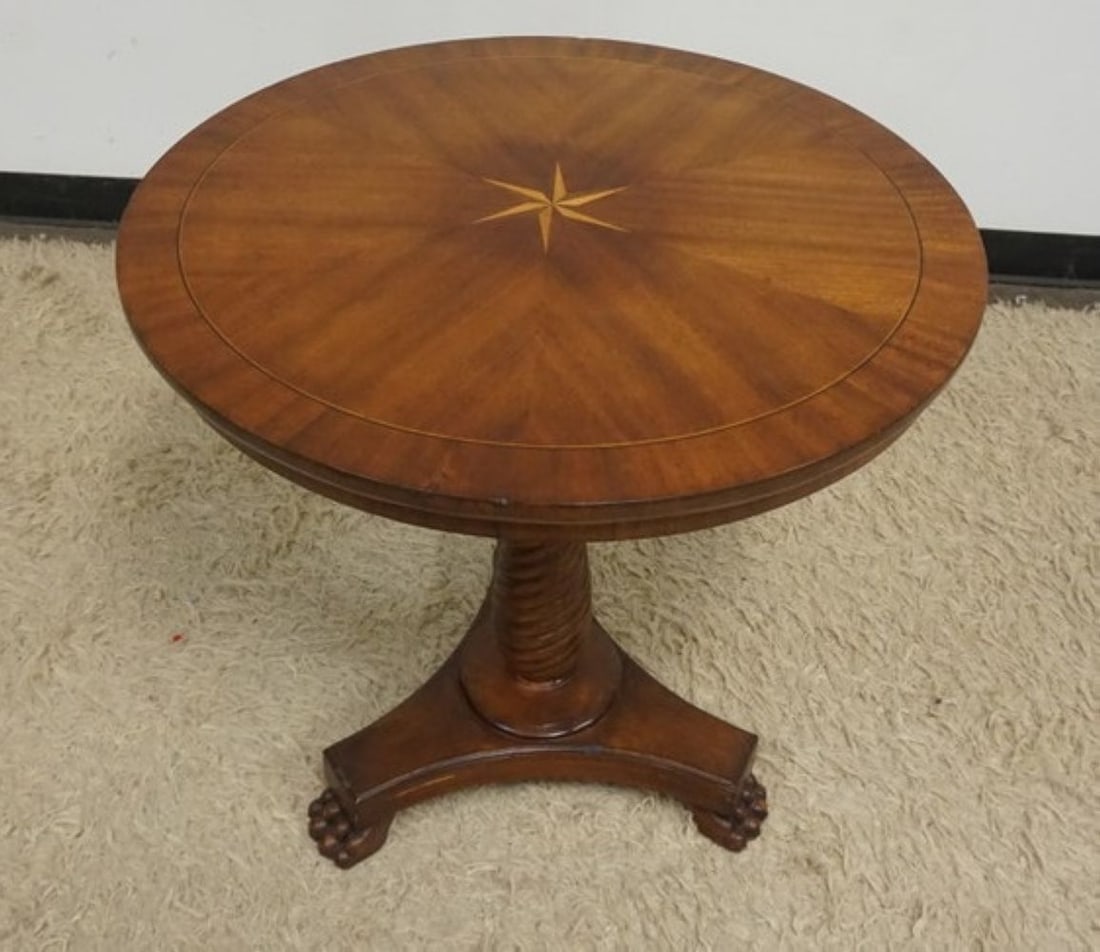 MAHOGANY LAMP TABLE: MAHOGANY ROUND LAMP TABLE WITH SPIRAL TURNED COLUMN CENTER, PAW FEET AND STAR INLAID TOP, APPROXIMATELY 28 IN X 27 IN H