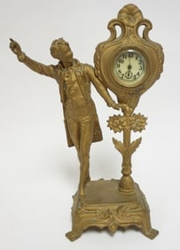 ANTIQUE CAST METAL FIGURAL CLOCK
