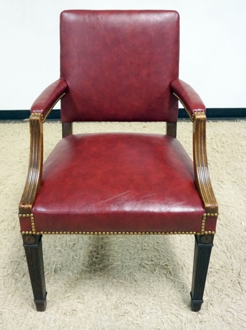 RED LEATHER ARM CHAIR: RED LEATHER ARM CHAIR WITH BRASS TACK ACCENTS, APPROXIMATELY 25 IN X 22 IN X 35 IN H