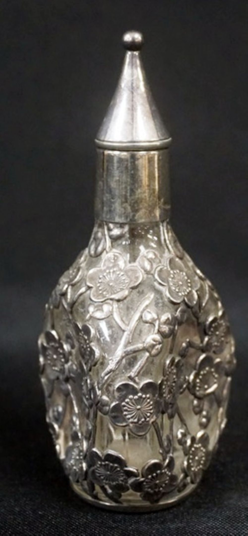 ANTIQUE STERLING SILVER OVERLAY PERFUME BOTTLE: ANTIQUE STERLING SILVER OVERLAY TOOLED PERFUME BOTTLE, FLORAL AND VINE OVER PINCH BOTTLE, APPROXIMATELY 5 IN H