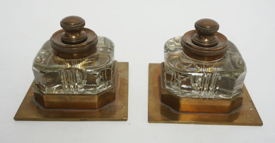 PAIR OF GLASS INKWELLS: PAIR OF GLASS INKWELLS IN SOLID BRASS BASES, EACH APPROXIMATELY 3 3/4 IN SQUARE X 3 1/4 IN HIGH