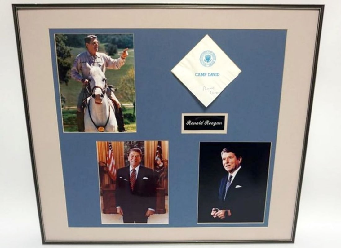 RONALD REAGAN FRAMED PHOTOS & CAMP DAVID NAPKIN: RONALD REAGAN FRAMED & MATTED PHOTOS & CAMP DAVID NAPKIN W/ATTRIBUTED SIGNATURES, APPROXIMATELY 28 IN X 25 IN OVERALL, NO GLASS