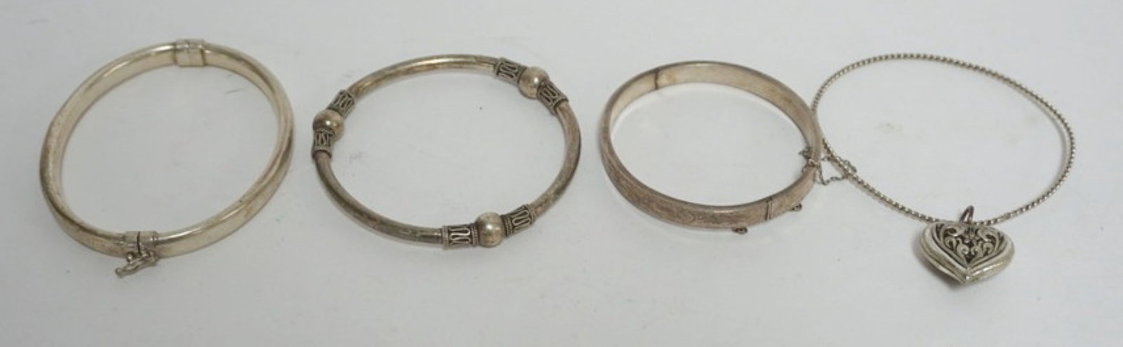 BRACLETS INCLUDING STERLING: 4 BRACELETS IN CLUDING 2 MARKED STERLING, .78 OZT