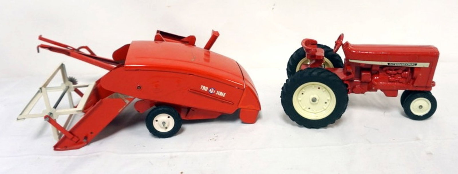 VINTAGE TOY INTERNATION TRACTOR AND ATTACHMENT (1 of 2)