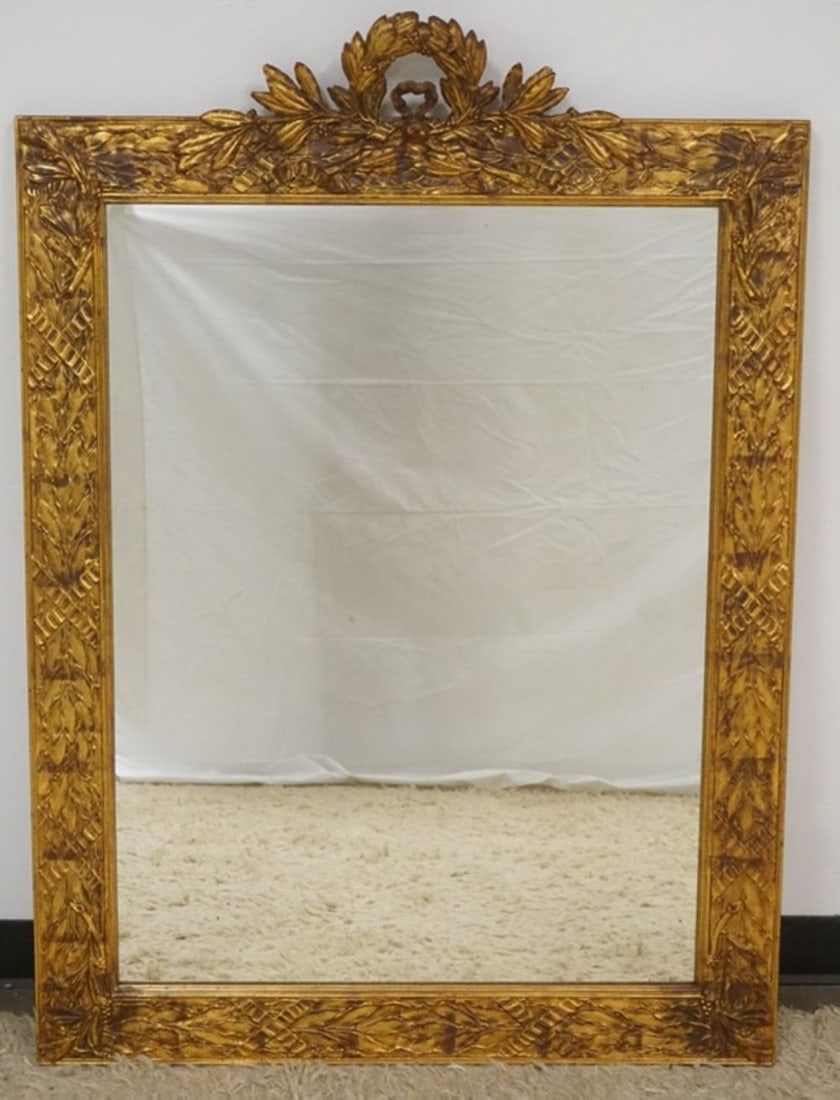 GILT GESSO MIRROR: HANGING MIRROR WITH GILT GESSO FRAME, SOME LOSS TO CREST, APPROXIMATELY 38 IN X 53 IN H