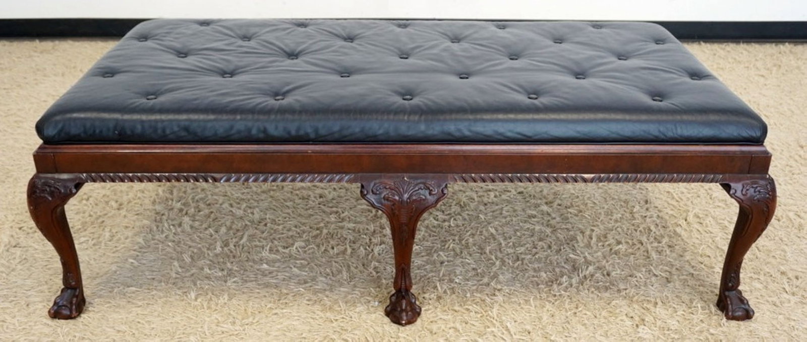 BAKER FURNITURE OVER SIZED BENCH: BAKER FURNITURE OVER SIZED BENCH WITH BALL AND CLAW FEET AND TUFTED LEATHER TOP, APPROXIMATELY 63 IN X 32 IN X 20 IN H