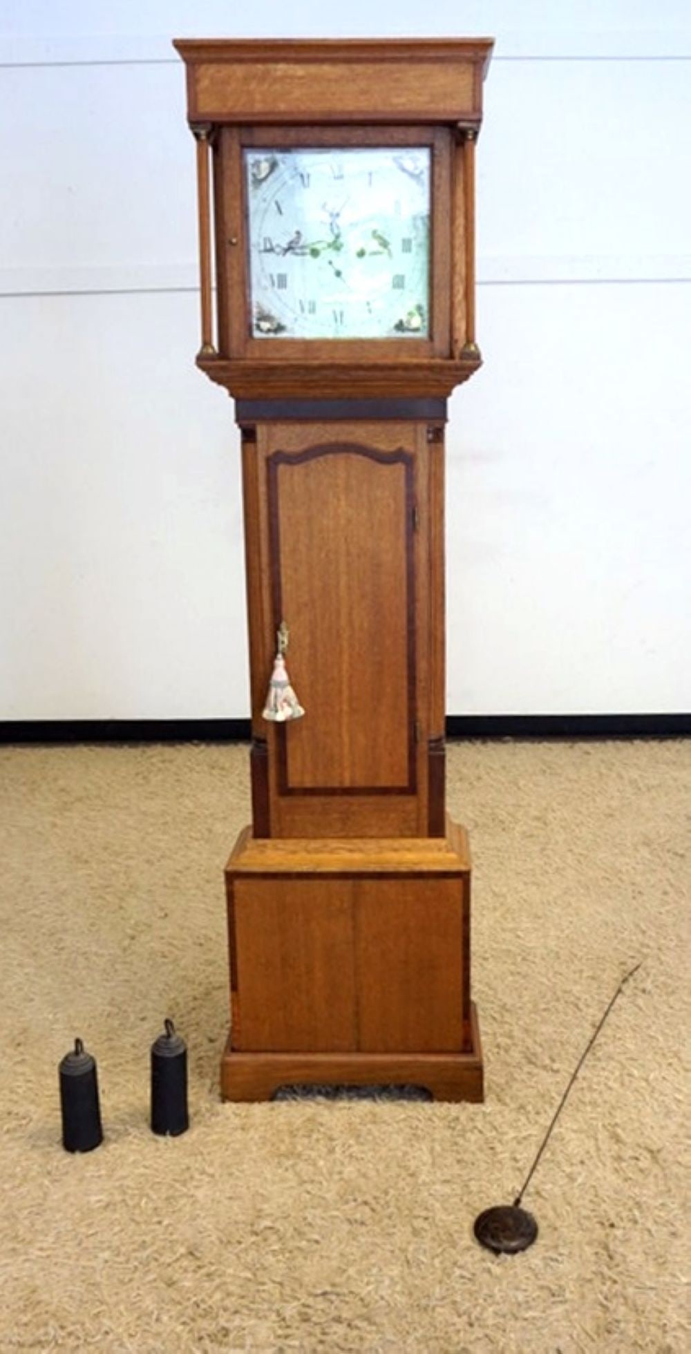 WALKER INNEMOTE GRANDFATHER CLOCK: WALKER INNEMOTE GRANDFATHER CLOCK IN OAK CASE WITH REEDED QUARTER COLUMNS AND HAND PAINTED DIAL WITH SEA SHELLS AND BIRDS, APPROXIMATELY 22 IN X 10 IN X 81 IN H