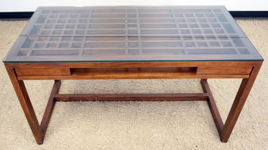 MODERN STYLE DESK: MODERN STYLE DESK WITH LATTICE WORK AND GLASS TOP, AND 1 CENTER DRAWER, APPROXIMATELY 26 IN X 54 IN X 31 IN H