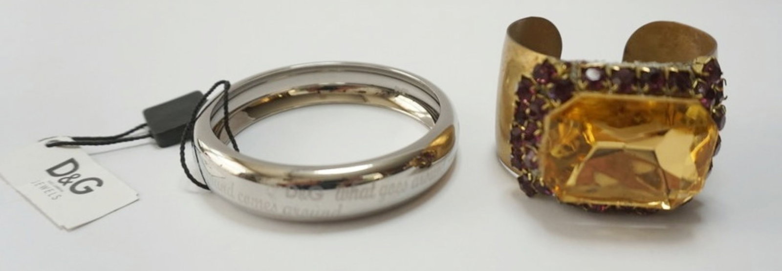 SIGNED CUFF AND BANGLE BRACELETS: ROBERTO S BRODSKY CUFF BRACELT WITH LARGE STONE SURROUNDED BY SMALLER STONES AND NEW DOLCE AND GABBANA BRACELET