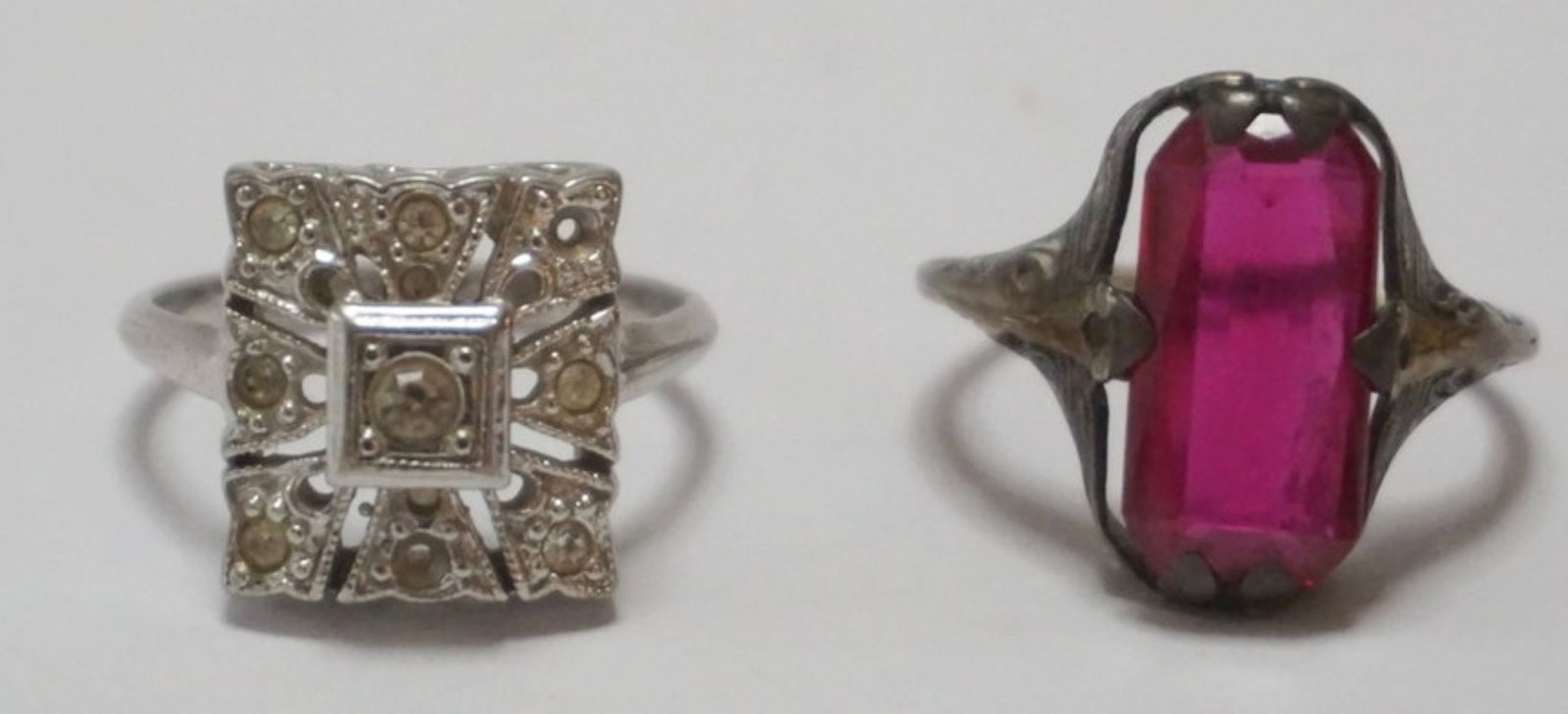 2 LADIES RINGS: 2 LADIES RINGS, 1 STERLING AND 18K RUBY COLORED STONE SIZE 7 1/2 AND 18K HE MARCASITE RING SIZE 7 1/2