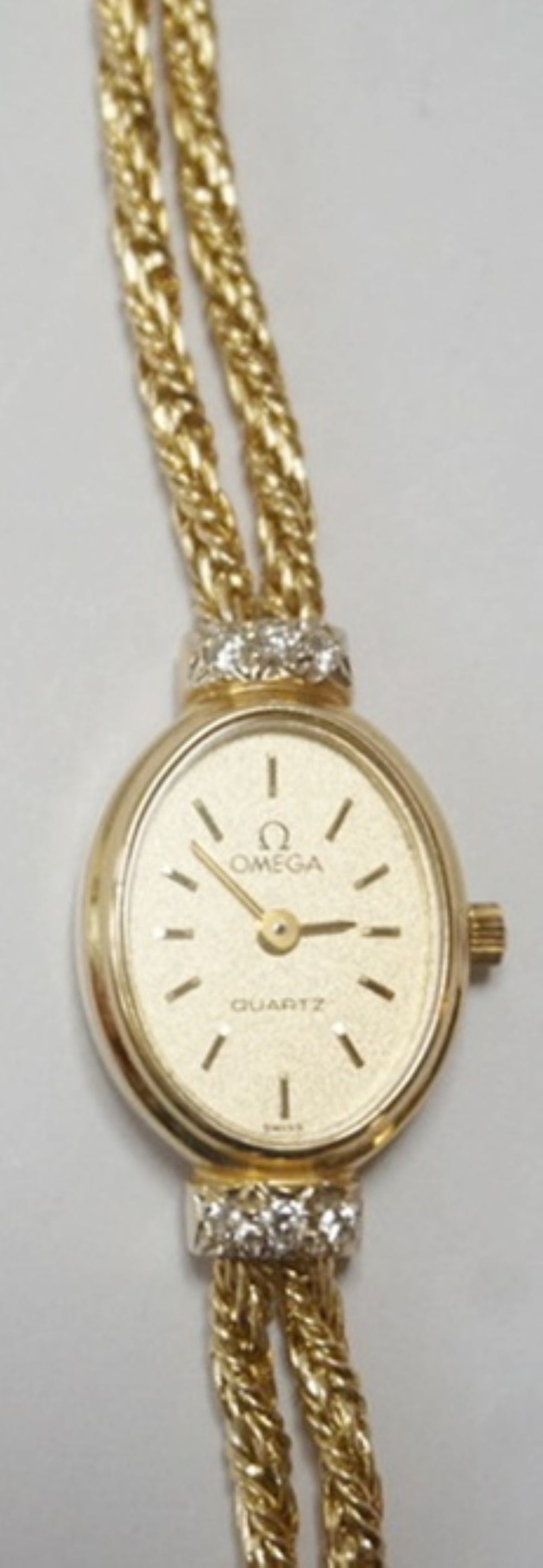 14K LADIES OMEGA WATCH: 14 K LADIES OMEGA WATCH AND BAND 1450, 10.17 DWT