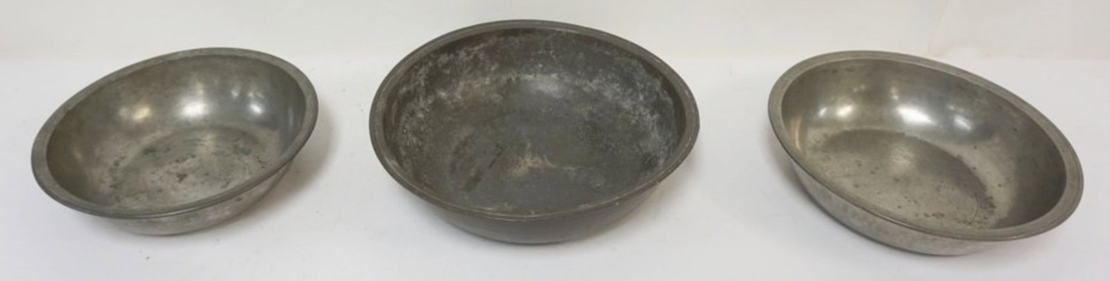 PEWTER BASINS: PEWTER BASINS, 1 MARKED COMPTON, LARGEST APPROXIMATELY 13 IN X 3.5 IN