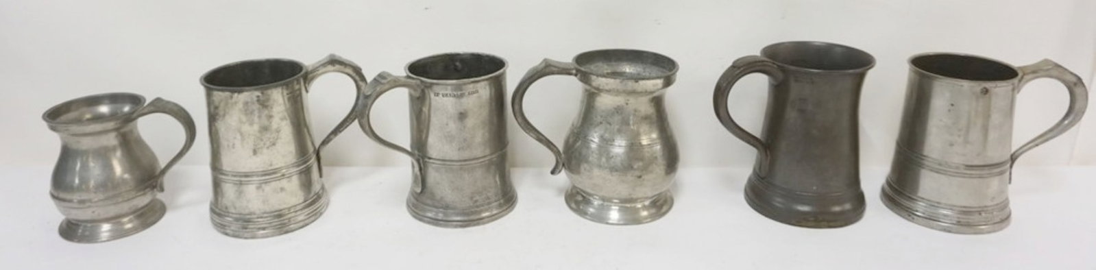 PEWTER TANKARDS AND MEASURES: GROUP OF PEWTER TANKARDS AND MEASURES, 3 MARKED JAMES YATES, LARGEST APPROXIMATELY 7 IN H