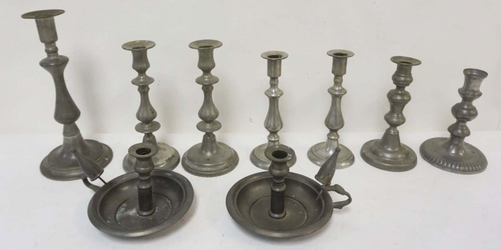 PEWTER CANDLESTICKS: LARGE GROUP OF PEWTER CANDLESTICS, INCLUDING PUSH UPSS, TALLEST APPROXIMATELY 11 IN H