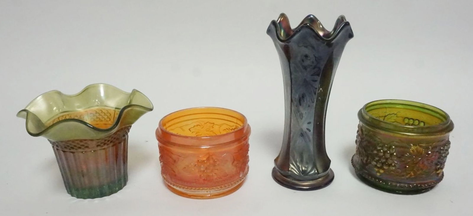 CARNIVAL GLASS: CARNIVAL GLASS ASSORTMENT INCLUDING RUFFLED HAT VASE, FENTON BLUE PANELED, DIAMOND & BOWS VASE & POWDER JARS, LARGEST APPROXIMATELY 6 1/2 IN
