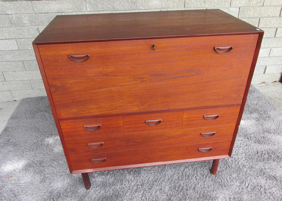 PETER HVIDT FOR J. JACOBSEN & SONNER TEAK CABINET: UNIQUE DROP FRONT DOOR WITH 2 SLIDE DRAWERS. A COUPLE OF LIGHT GOUGES IN TOP AND A COUPLE OF AREAS OF MATERIAL LOSS ON THE FRONT CORNERS. GOOD ORIGINAL VINTAGE CONDITION.