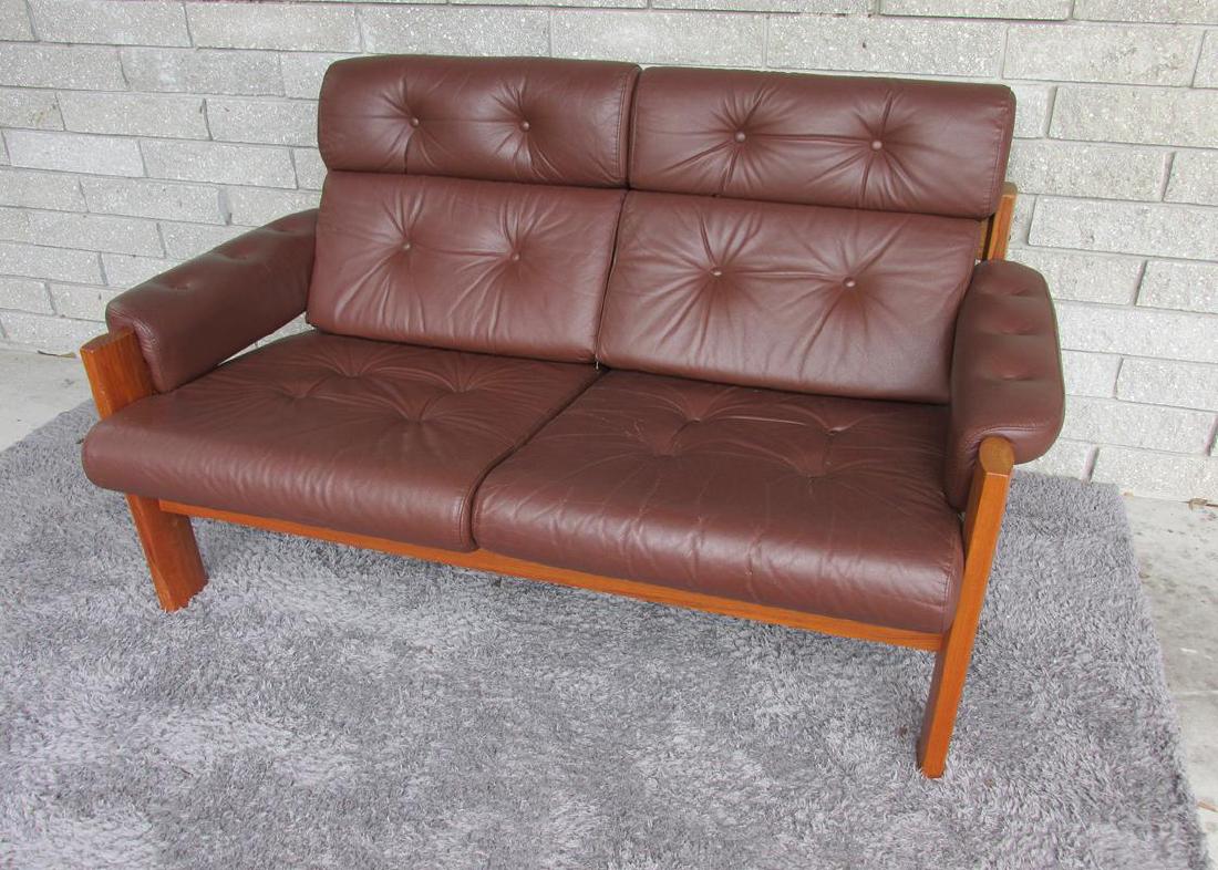 EKORNES LOVESEAT: LEATHER UPHOLSTERY LIGHT WEAR WITH ONE DETACHED BUTTON (INCLUDED), WOOD FRAME, 55"L, 31"D