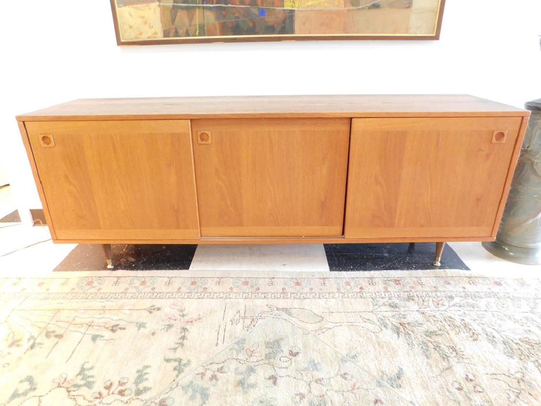 DANISH TEAK CREDENZA: THREE SLIDING DOORS, WITH TWO DRAWERS. HARDWOOD LEGS ARE NOT ORIGINAL TO THIS CABINET. 71W, 17.5D, 26.5H