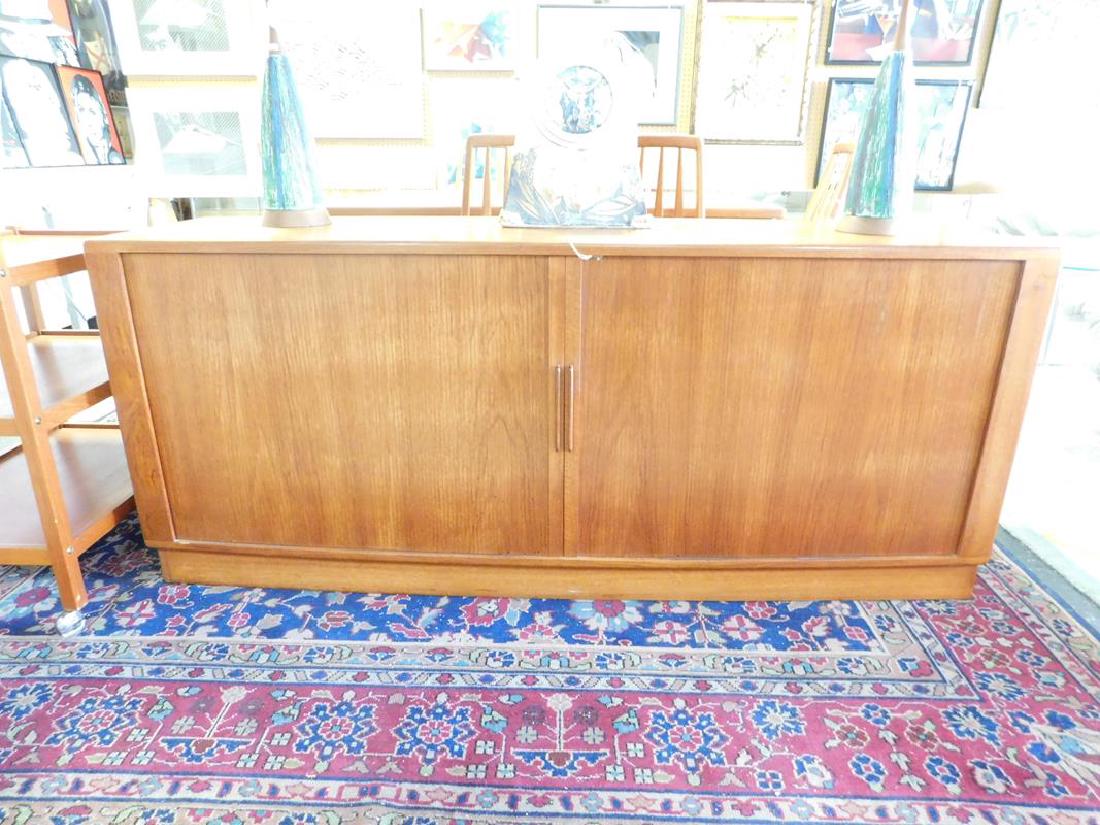 H.P. HANSEN DANISH MODERN TEAK CABINET: BOWFRONT, TAMBOUR DOOR FRONT REVEALING TO BANKS OF SHELVING AND 4 DRAWERS