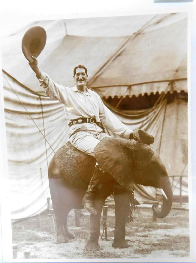 H.A. ATWELL (AMERICAN, 1879-1957) PHOTOGRAPH: FEATURING JACK EARLE, R.B.B.B. SIDESHOW GIANT, WITH ELEPHANT. H.A. ATWELL RUBBER/INK STAMP ON VERSO. EXCELLENT CONDITION. 8"X10"