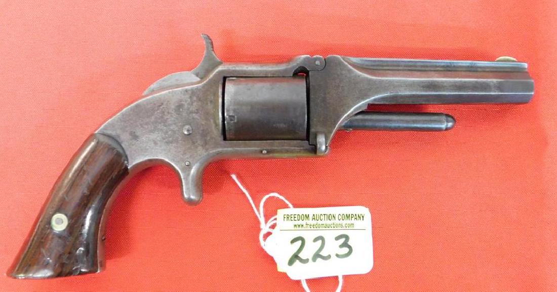 SMITH & WESSON MODEL 1 1/2 REVOLVER: SERIAL #4237. .32 CAL. 1ST ISSUE. SPUR TRIGGER, 5-SHOT NON-FLUTED CYLINDER. 3" OCTAGONAL BARREL. ROSEWOOD GRIPS. C. 1862-1868. GOOD CONIDTION.