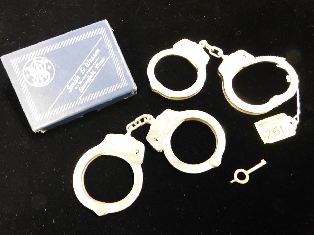 SMITH & WESSON HAND-CUFFS: TWO PAIR