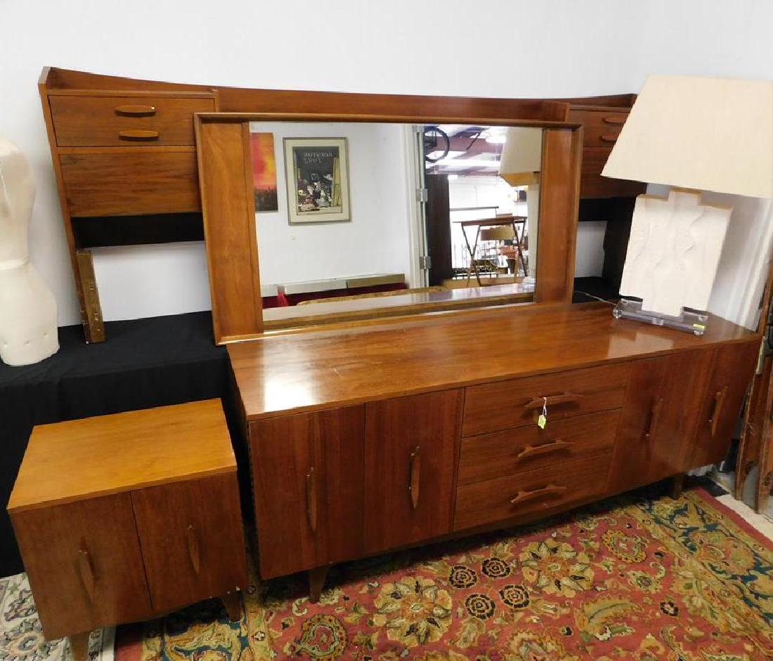 MID-CENTURY BEDROOM SUITE: TRIPLE DRESSER (REPAIR ON BASE NOT SEEN WHEN UPRIGHT), MIRROR, KING HEADBOARD, SIDE STAND.