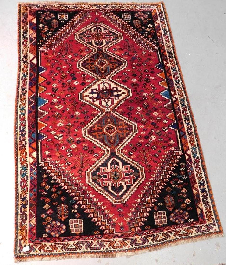 CAUCASIAN ORIENTAL CARPET: DEEP RED FIELD. CENTRAL MTIF OF RUNNING HEXAGONS AND INDIGO SPANDRALS. GOOD OVERALL PILE. SOME BLEEDING OF COLORS ON OUTSIDE BORDERS. 7'11"X5'2"