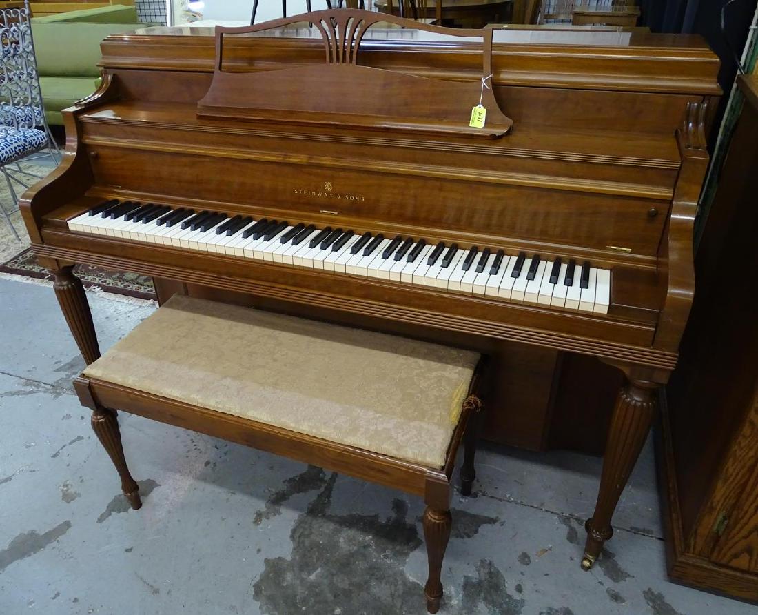 STEINWAY & SONS SPINET PIANO: WALNUT FINISH. SERIAL #Y3917/F420217. MADE IN 1970. SOME VENEER LOSS AT LEFT SIDE WHERE LEG MEETS BODY. OVERALL GOOD CONDITION.